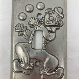 Vintage Seagull Pewter clown light switch